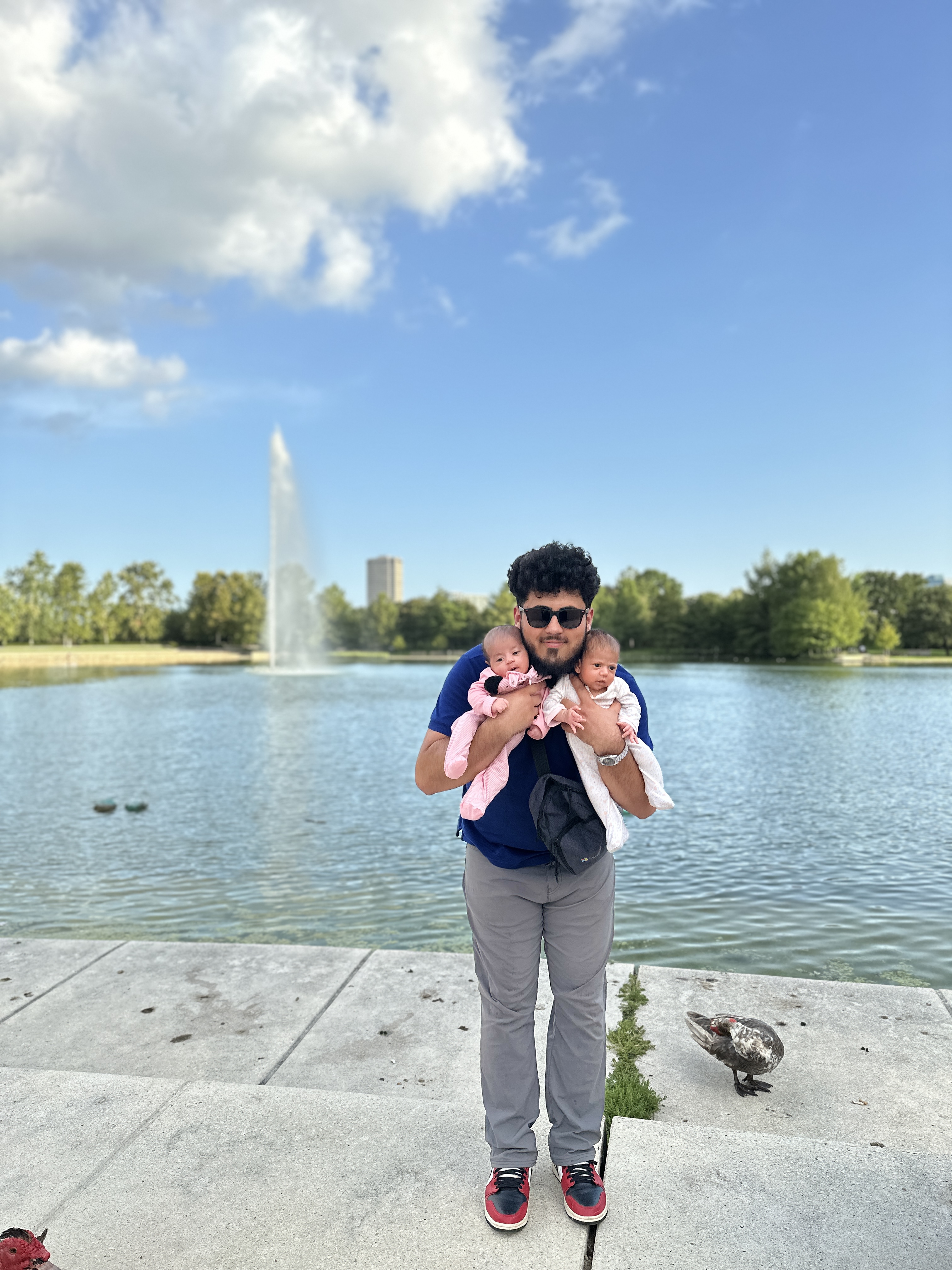 Kbib Walk with his twin daughters